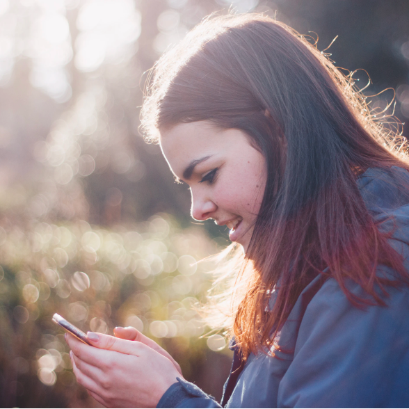 Image of a girl using her phone